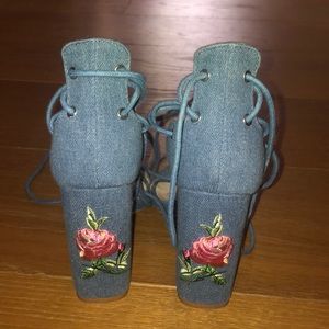 Denim lace-up heels with an embroidered rose